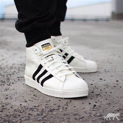 high top Adidas shell toe